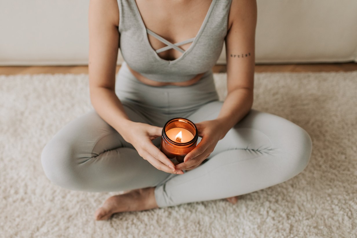 Woman Holding a Lighted Candle in Jar