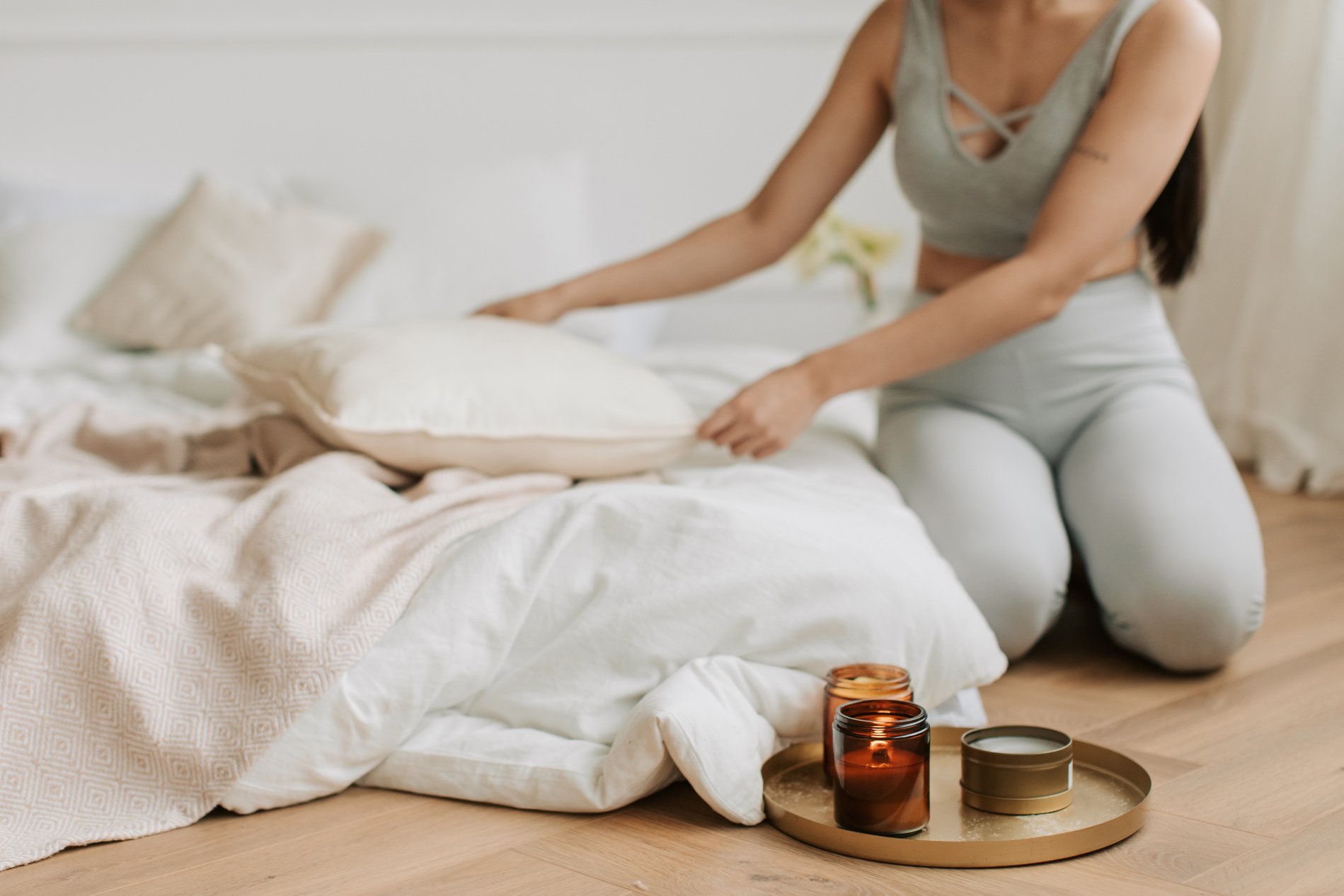 Woman Arranging Her Bed